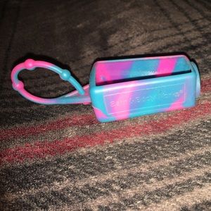 Blue and pink mini hand sanitizer holder.